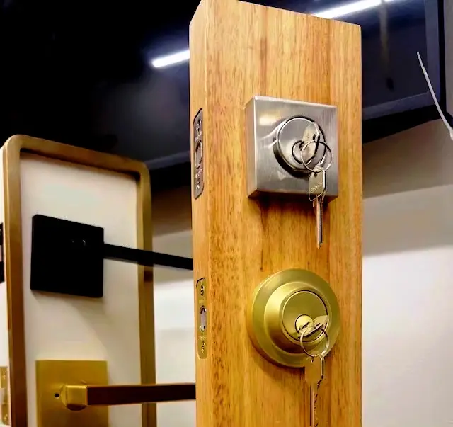 Display deadbolt and mortise lock cylinders with keys at Aura Locksmith's Brooklyn storefront