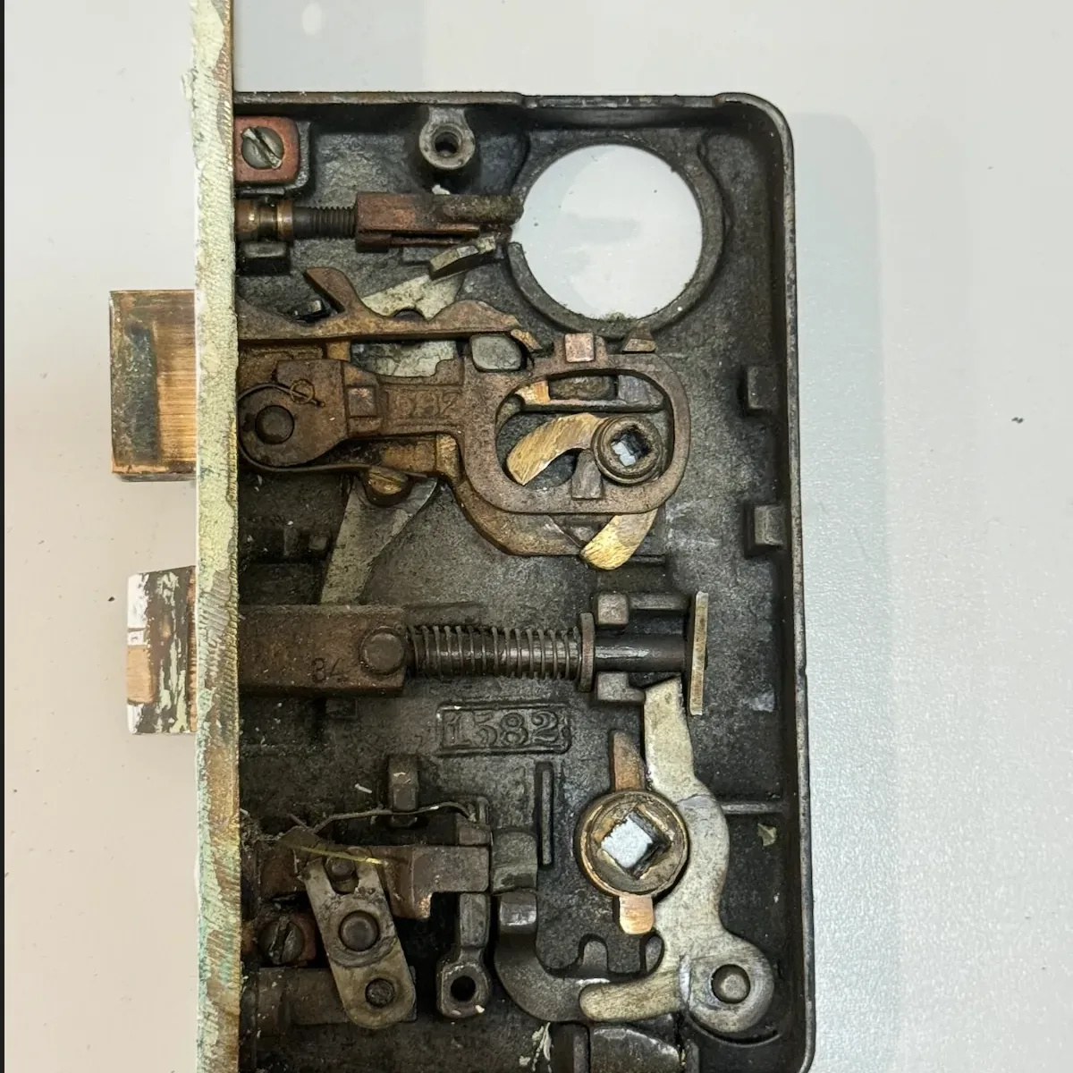 Vintage mortise lock body opened for cleaning, repair, and restoration by Aura Locksmith