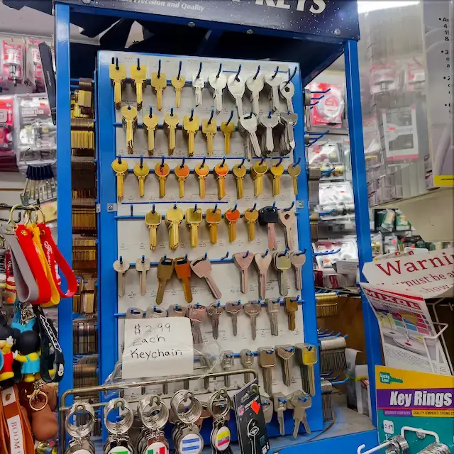 Wall of key blanks and keychains at Aura Locksmith's Brooklyn key duplication station