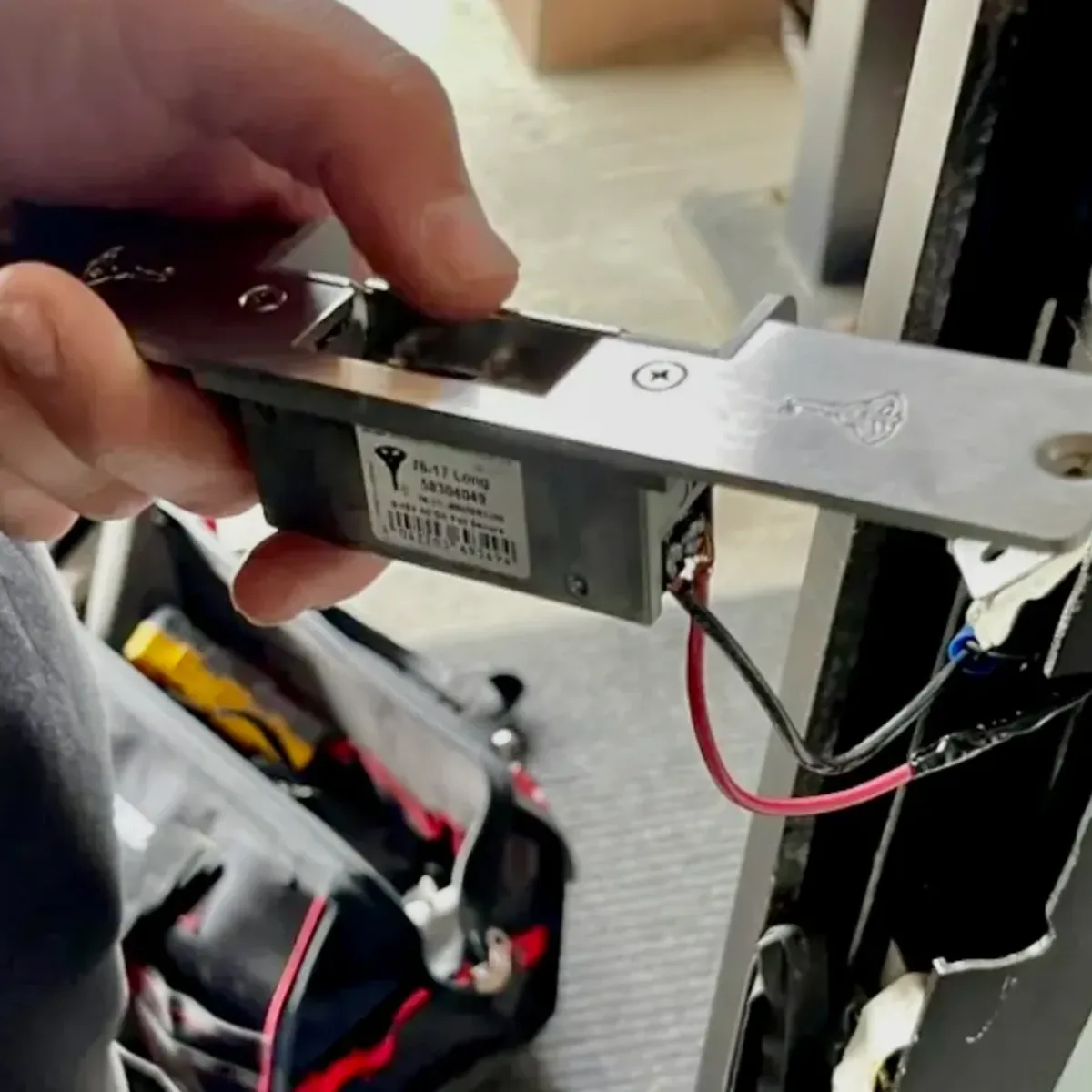 Mul-T-Lock electric strike being replaced on a commercial door by Aura Locksmith