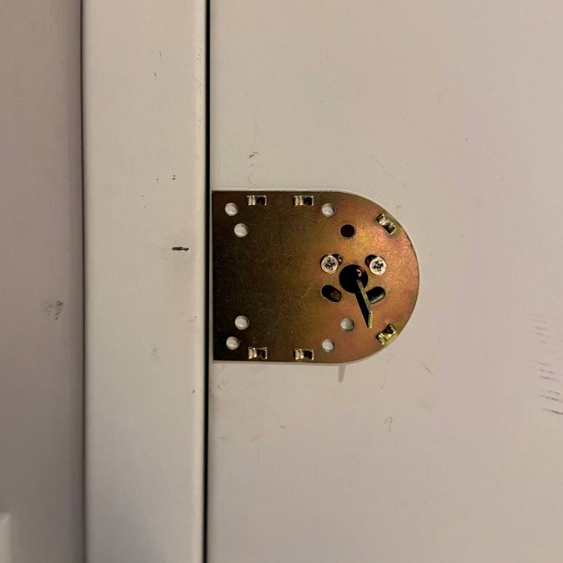 Reinforced strike plate installed on a Brooklyn apartment door jamb by Aura Locksmith during a new lock installation